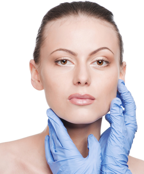 Beautician touch and exam health woman face - Foto, imagen