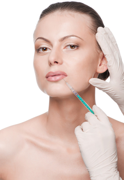 cosmetische botox injectie in het gezicht van de schoonheid - Foto, afbeelding