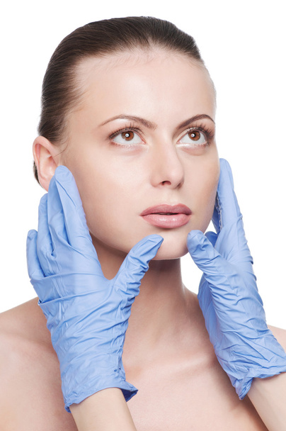 Beautician touch and exam health woman face - Foto, Imagen
