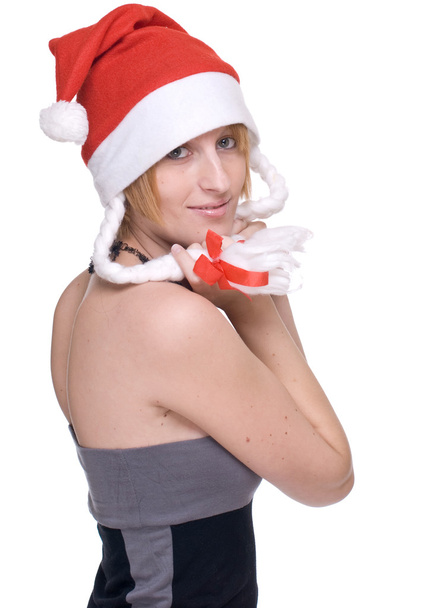 Close up portrait of girl in grey dress and santa claus hat - 写真・画像