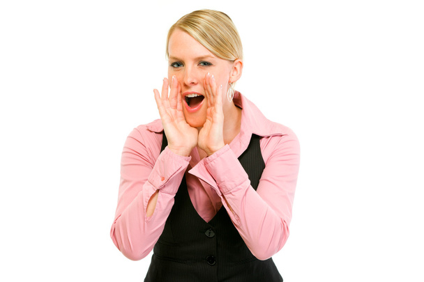 Cheerful modern business woman shouting through megaphone shaped hands - Foto, afbeelding