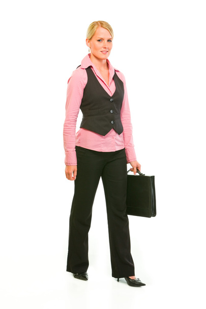 Happy modern business woman with suitcase making step - Foto, Imagen