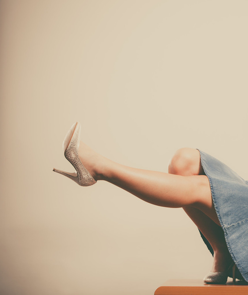 Closeup of sexy woman legs in high heels and skirt - Фото, зображення