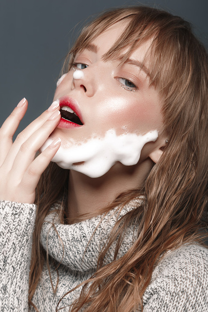 Young girl in sweater with foam beard - Foto, immagini