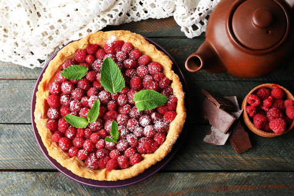 Tart with fresh raspberries and teapot - Photo, Image