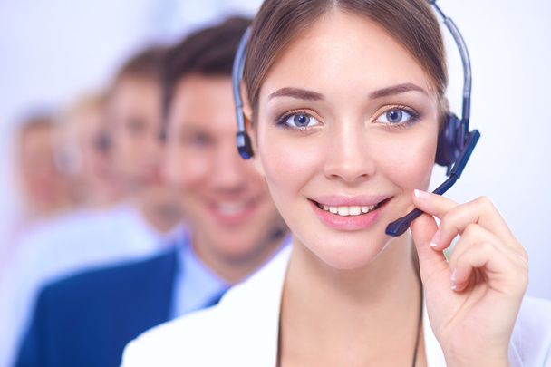 Attractive Smiling positive young businesspeople and colleagues in a call center office - Foto, Bild