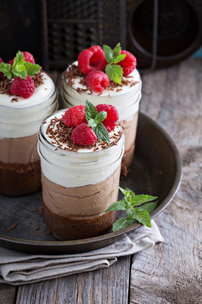 Three chocolate mousse dessert in a jar - Foto, Bild