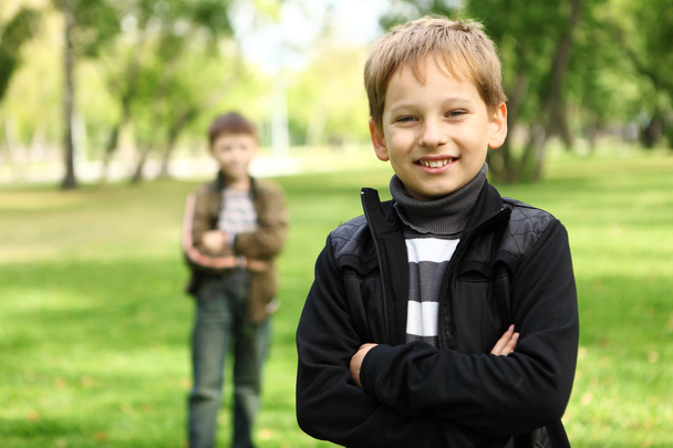 Boy with a friend in the green park - Fotó, kép