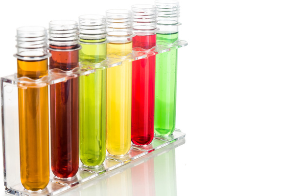 Test tubes with multi color chemicals isolated in white - Foto, imagen