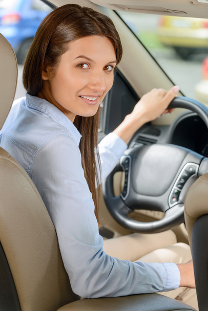 Pleasant girl driving a car - Foto, afbeelding