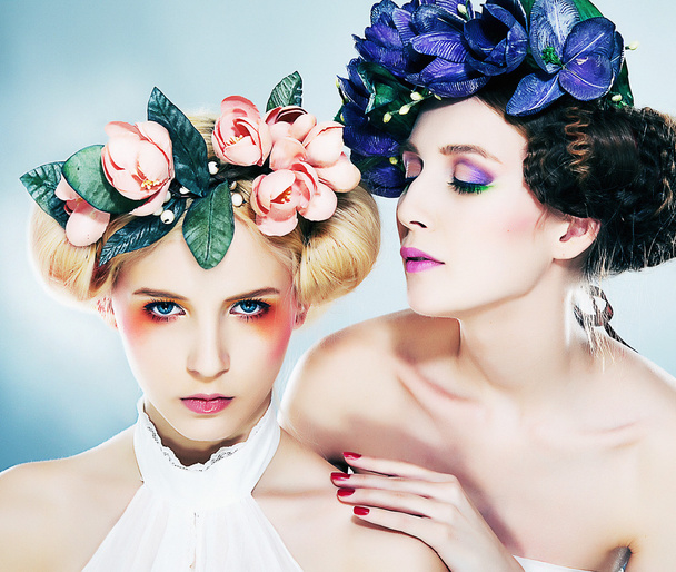 Two sensual nymphs in colorful wreaths closeup portrait - Фото, изображение