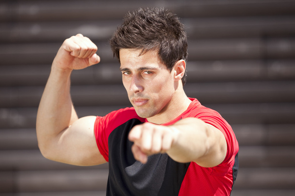 Athlete showing his muscles - 写真・画像