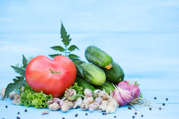 Fresh vegetables on blue wooden background. - Photo, Image