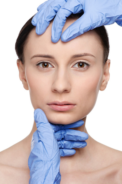 Beautician touch and exam health woman face. - Foto, immagini