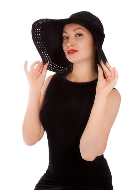 Beautiful woman with red lips in little black dress and hat iso - Photo, Image