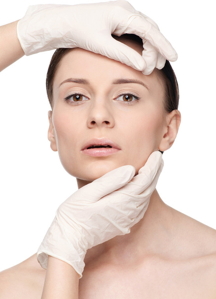 Beautician touch and exam health woman face. - Foto, Imagen
