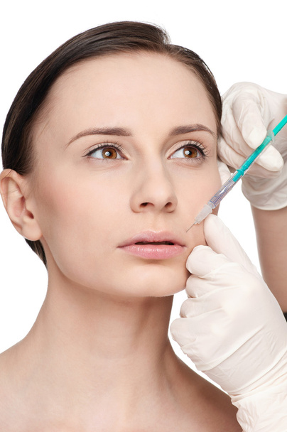 cosmetische botox injectie in het gezicht van de schoonheid - Foto, afbeelding
