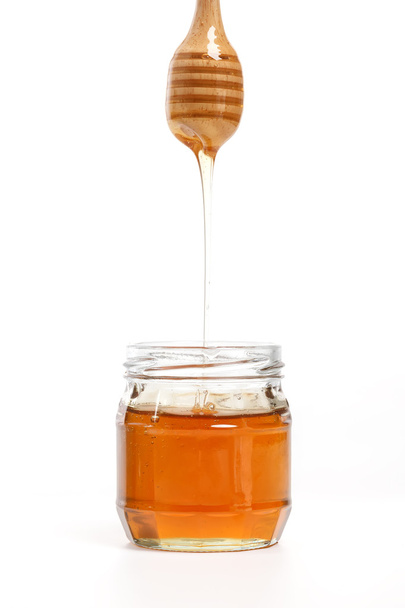 honey dipper delicious white background closeup sweet healthy - Foto, imagen