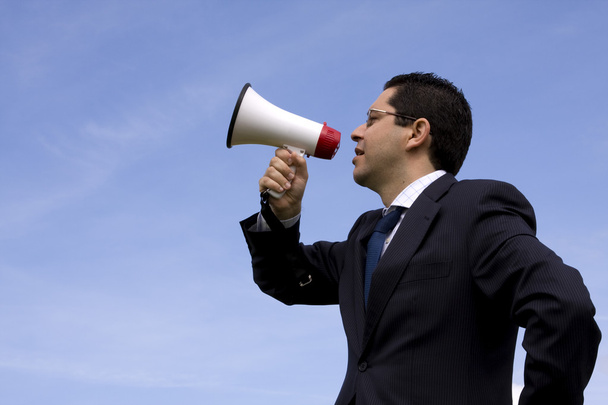 Businessman speaking with a megaphone - Foto, immagini
