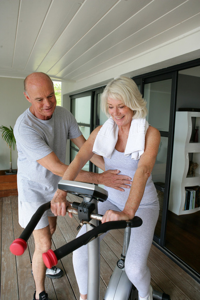 Personal trainer helping his client with her posture - Valokuva, kuva