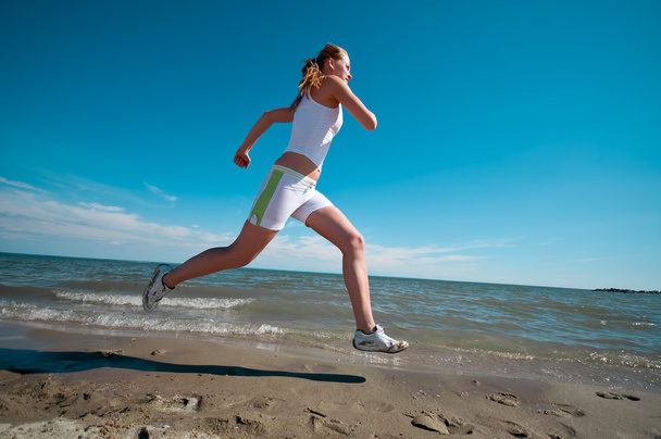 Sport woman running in sea coast - Foto, Imagem