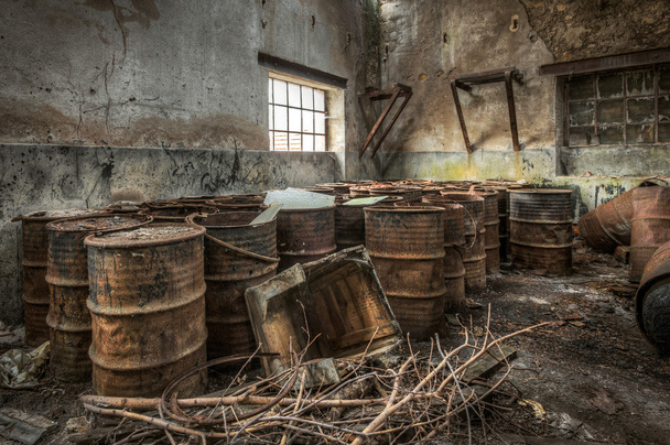 Rusty barrels stored in an abandoned factory - Photo, image