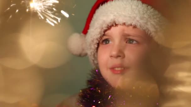 little boy dressed as Santa Claus, soft focus - Materiał filmowy, wideo