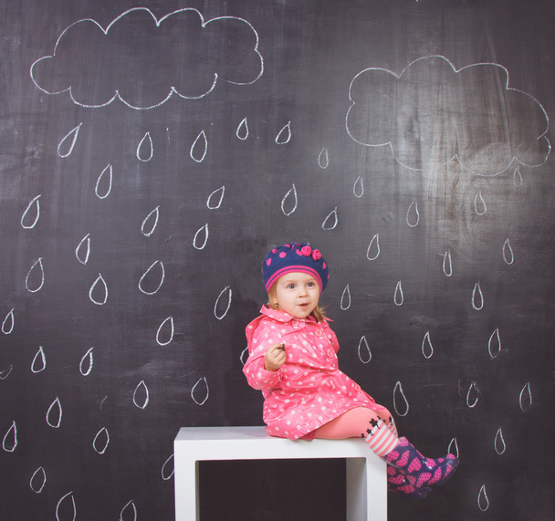 Little girl in pink raincoat - Photo, Image