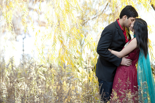 Young Indian Couple Kissing - 写真・画像