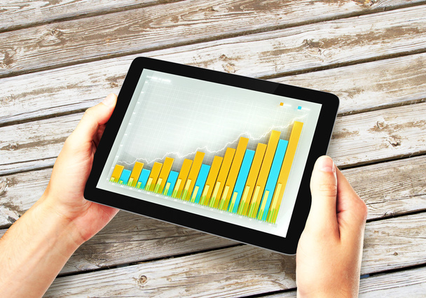 Girl holding tablet with business chart - Foto, Imagen