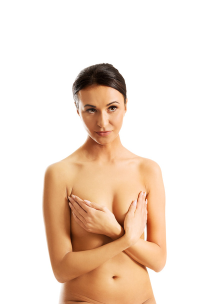 Nude woman covering her breast - Fotó, kép