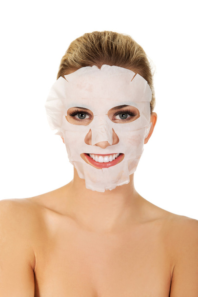 Young woman with facial mask - Foto, Imagem