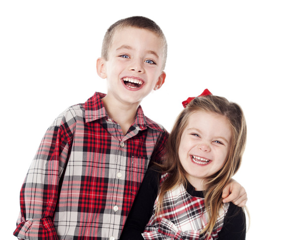 Siblings embracing in holiday clothes - Foto, immagini