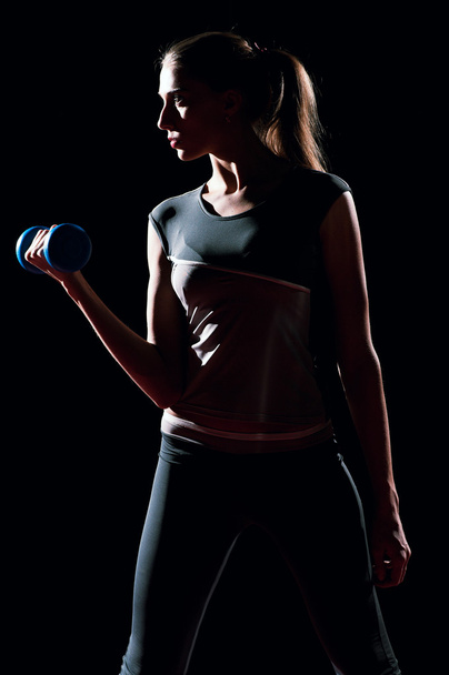 Beautiful sport woman doing power fitness exercise - Фото, зображення