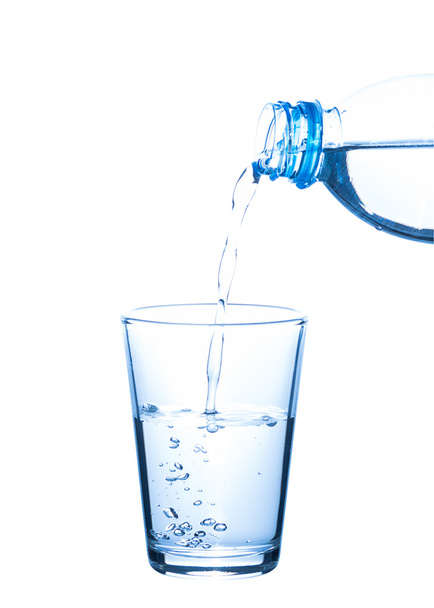 Pouring water from bottle into glass - Zdjęcie, obraz