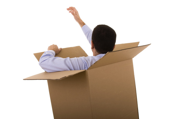 Businessman in a cardboard box - Zdjęcie, obraz