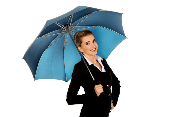 Smile businesswoman holding an umbrella - Zdjęcie, obraz