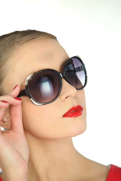 Attractive blond woman posing in sunglasses - Fotoğraf, Görsel