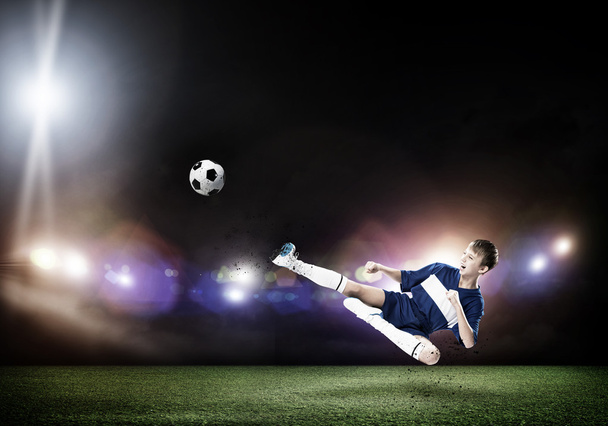 Kid boy kicking soccer ball - Foto, immagini