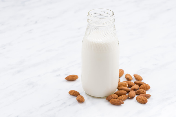 almond milk in a glass bottle - Photo, Image