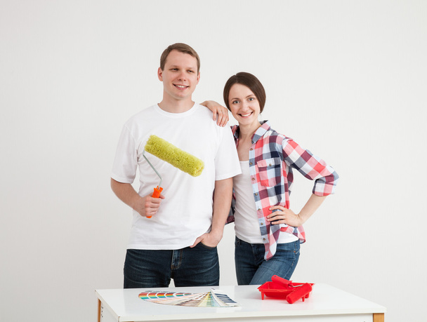 Young couple discussing a renovation of a home - Fotó, kép