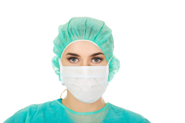 Female surgeon doctor in protective mask - Foto, afbeelding