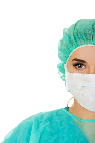 Close-up portrait of female surgeon doctor in mask - Фото, изображение