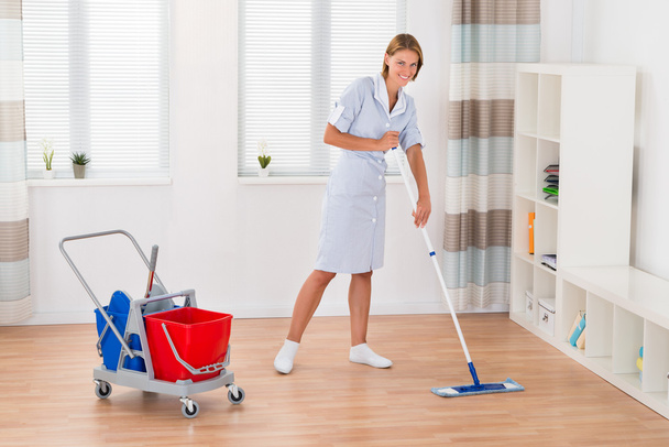 Female Housekeeper Cleaning Floor With Mop - Photo, image