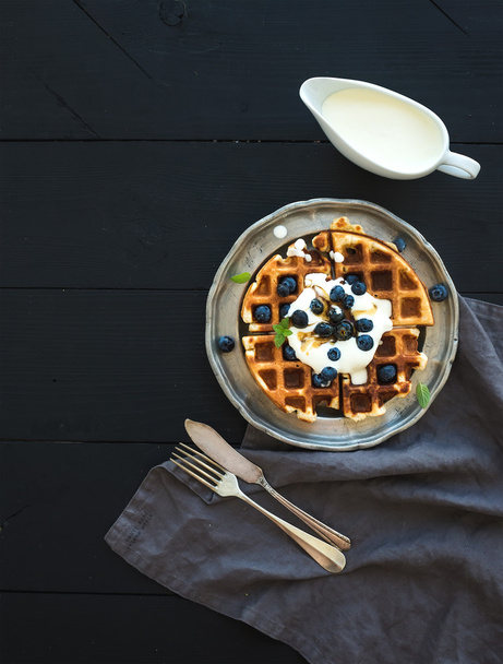 Soft Belgian waffles with blueberries - 写真・画像