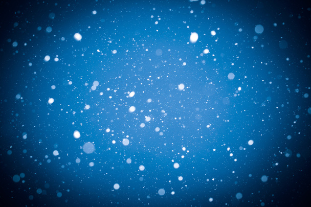 falling snow on blue background - Fotoğraf, Görsel