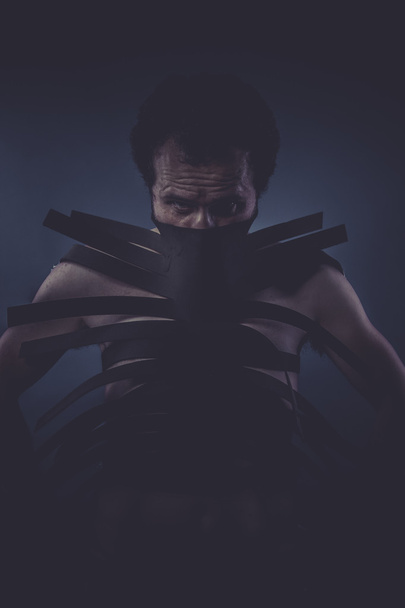 Man covered with black strips - Fotografie, Obrázek
