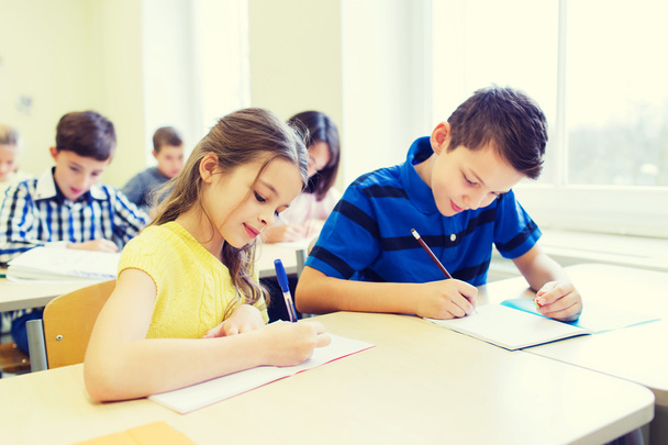 group of school kids writing test in classroom - Fotografie, Obrázek