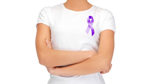 close up of woman with purple awareness ribbon - Foto, Imagen