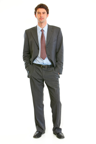 Confident modern businessman with hands in pockets - Zdjęcie, obraz